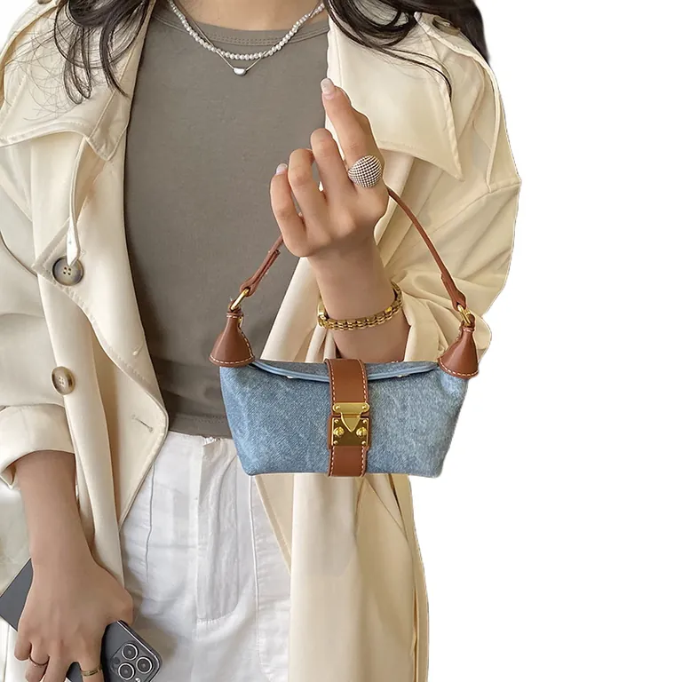 Washed denim mini hobo bag with brown leather trim, top handle carry