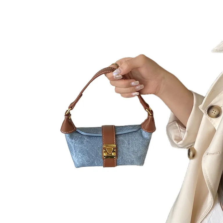 Mini hobo bag in washed denim held by the short top handle