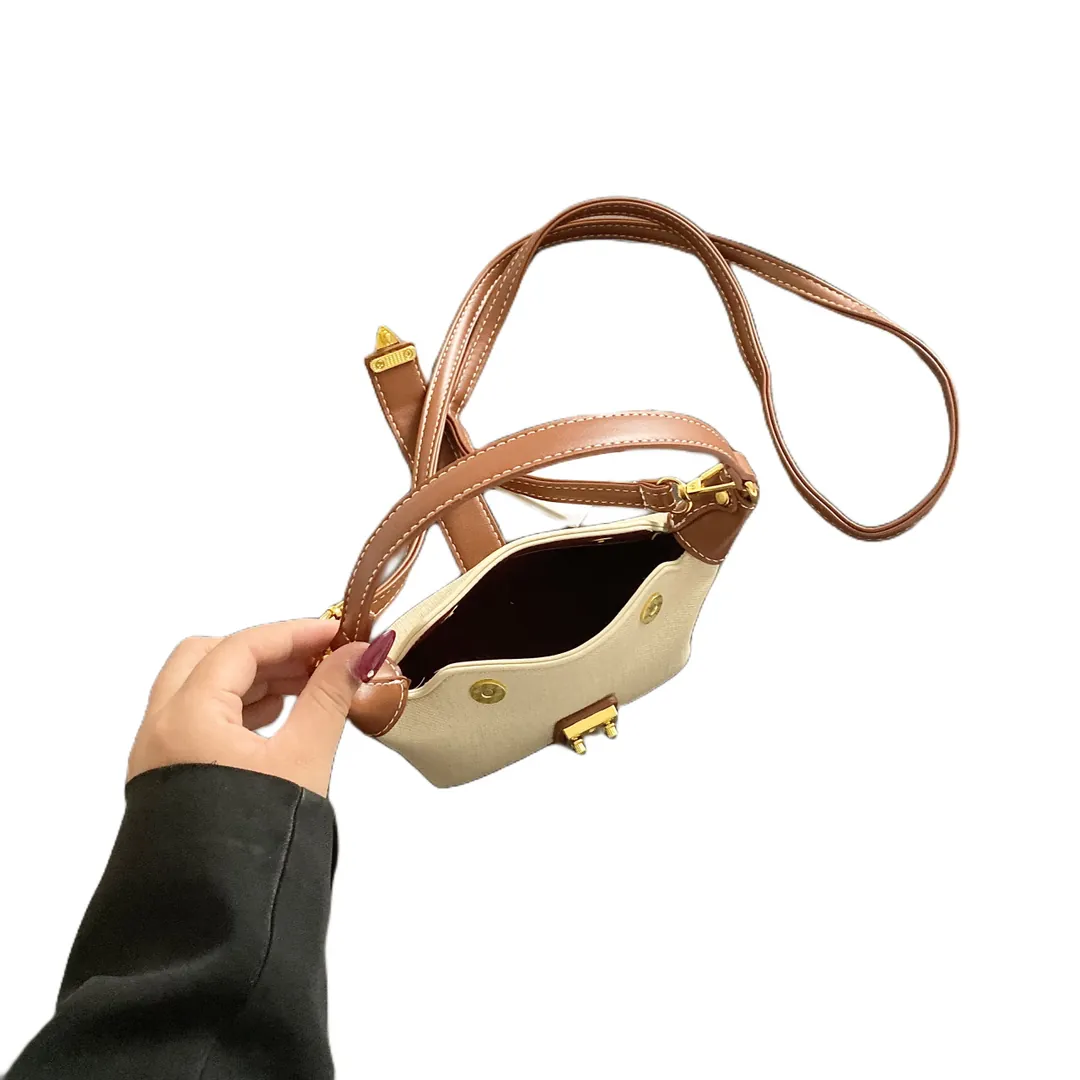 Open interior of the mini hobo bag showing the zipped main compartment