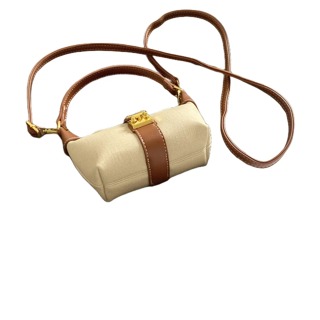 Two-way carry mini hobo bag shown with top handle and long shoulder strap